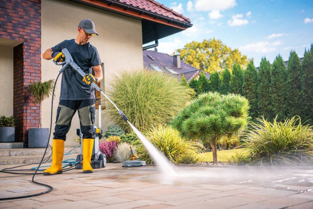 Power washing a patio surface